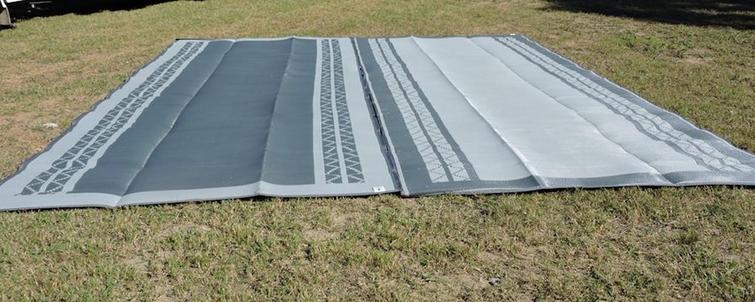 Camping mat from Jawa Off Road Campers in Sunshine Coast. Light grey and dark grey mat with chevron pattern for caravan.