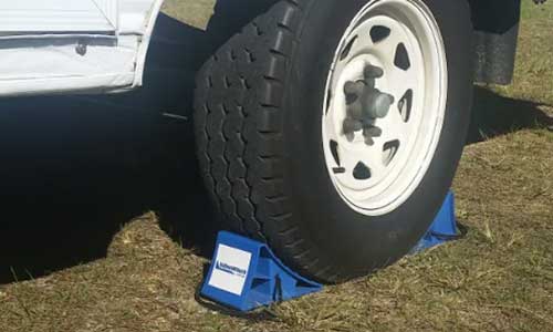 OziBlock n Chock Wheel Chock set of 2 with rope handles for securing caravan wheels. Keep your camper trailer in the same place at your off road campsite with OziBlocks available at Sunshine Coast Queensland Jawa Camper Trailers.