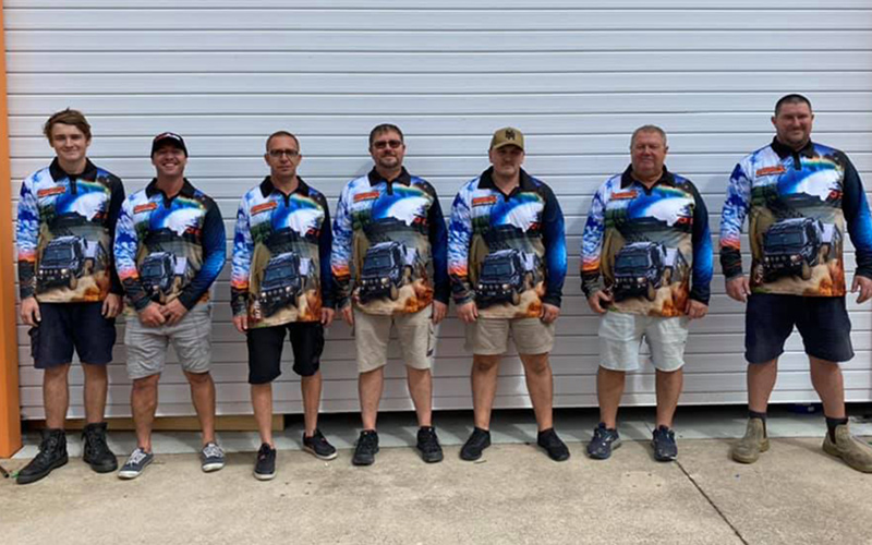 Jawa Off Road Camper Trailers Long sleeve blue fishing shirts worn by six different men of varying ages and sizes front view. Available in Sunshine Coast Queensland.
