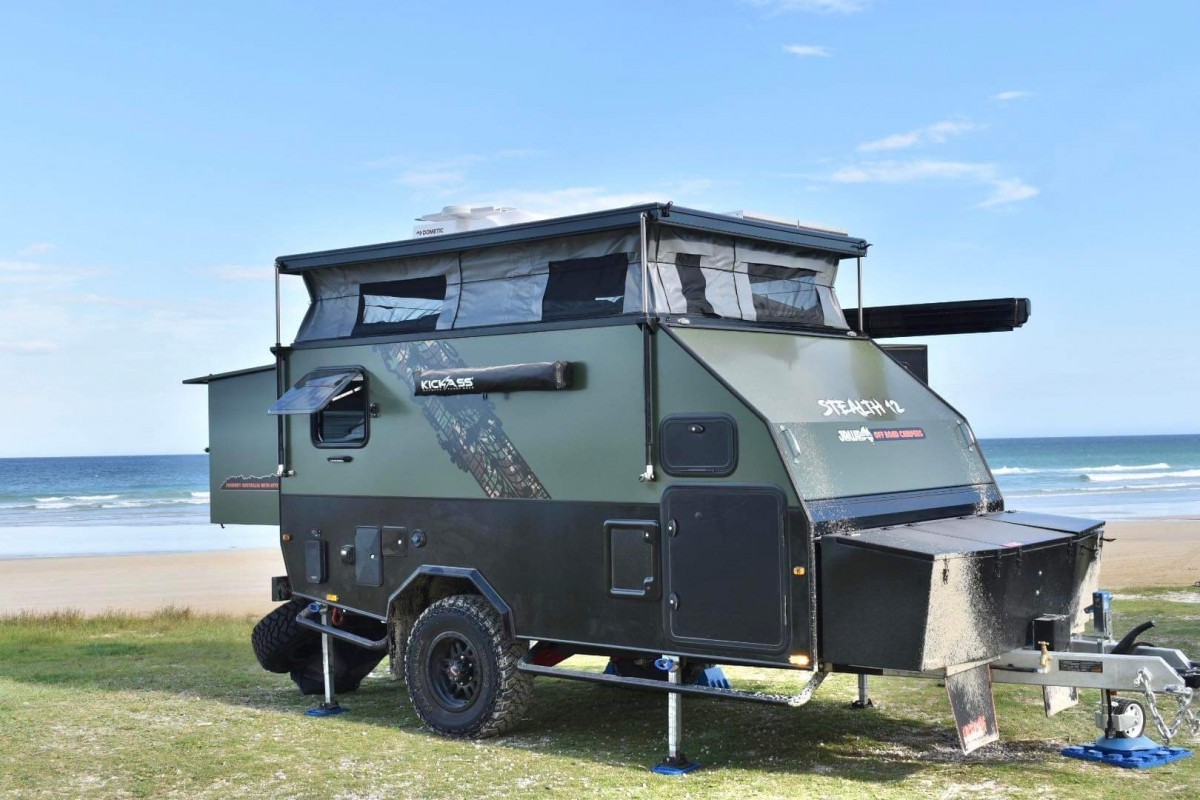Jawa Stealth 12 parked for campsite off road by the breach. Hybrid caravan rood popped up and back extended for comfort during tough outback adventures. Available in Sunshine Coast Queensland.