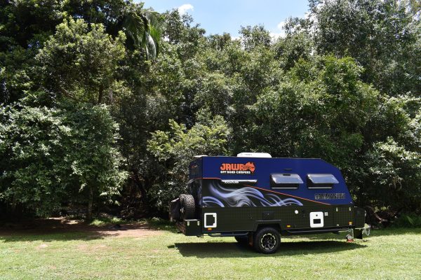 Jawa Hard Top Caravan The Commander. Camper Trailer parked alone in reserve, wide side view. Available in Sunshine Coast Queensland.