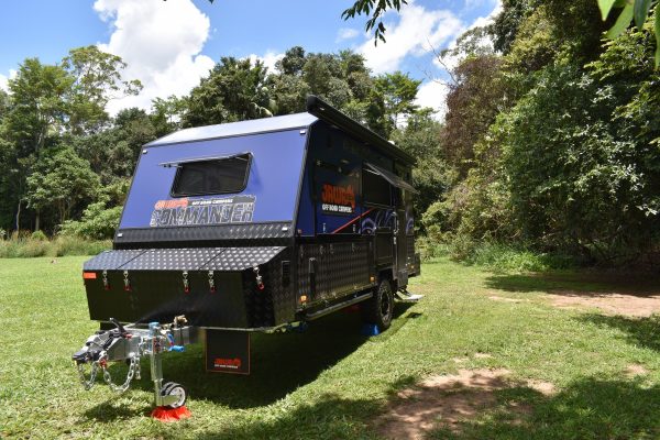 Jawa Commander hard top caravan camper trailer for off road travel parked in a reserve. Available from the Sunshine Coast Queensland