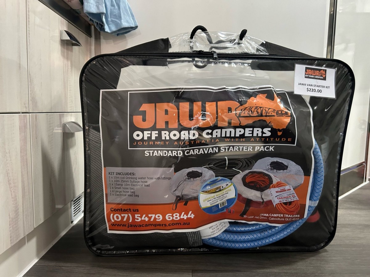 Jawa Off Road Camper Trailers Standard Caravan Starter Pack in plastic case available in Sunshine Coast Queensland. Bag with coil water hose with fittings, sullage hose, electrical lead, small hose bag, large hose bag and electrical lead bag.
