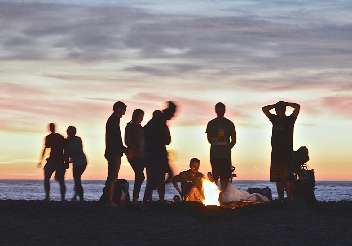 Boys beers on the beach at night - off road caravan adventure